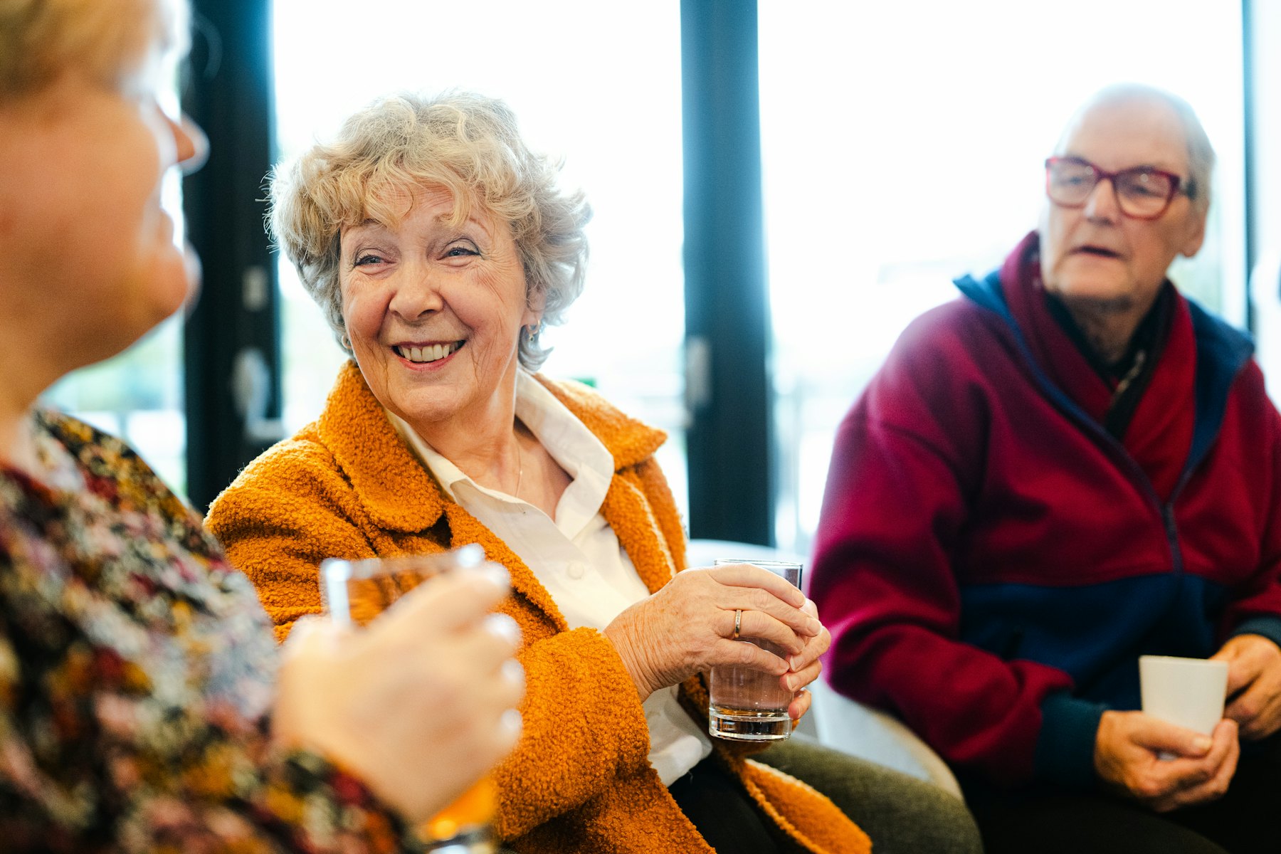 A group of adults laughing together